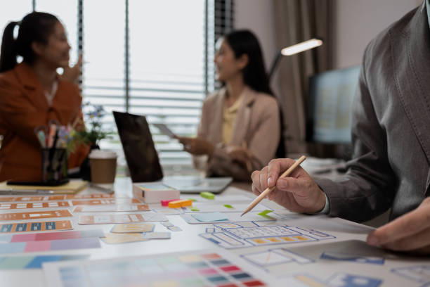 istock drawing website ux ui app for mobile phone application and development template layout, UI development, designer team working on a project of ux ui in creative office, team of creative web 2191989297