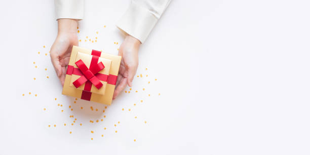 istock Celebration,special day and anniversary deas with young person hand giving chic gift box present decoration.Merry christmas or new year 2191994361
