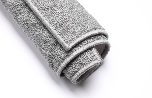 istock Roll of gray rug on white background 2191996779