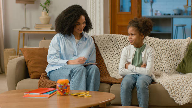 istock African American mother daughter child study development conversation talk gesture smile treatment speech speak healthcare support offspring females maternity childcare home living room family leisure 2191997675