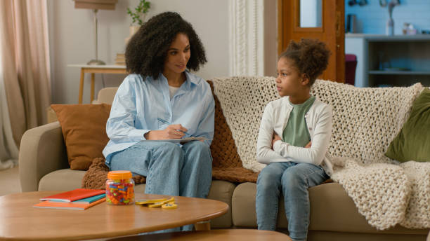 istock African American mother daughter child study development conversation talk gesture smile treatment speech speak healthcare support offspring females maternity childcare home living room family leisure 2191997833