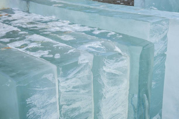 istock Transparent blocks of ice arranged in a natural setting during daylight reveal intricate textures and shades of blue 2191999838