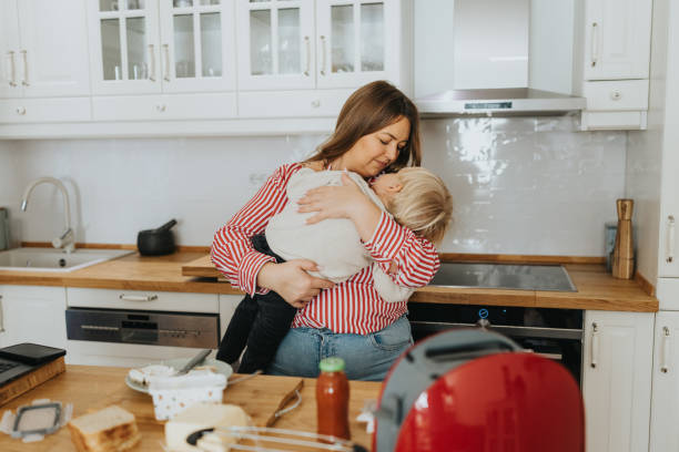 istock Loving mother and baby son during breakfast time at home 2192005243