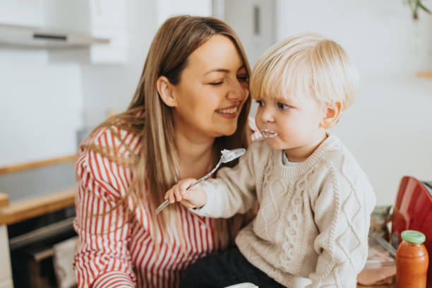 istock Mother and baby son bonding during breakfast at home 2192005245