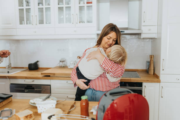 istock Loving mother and baby son during breakfast time at home 2192005349
