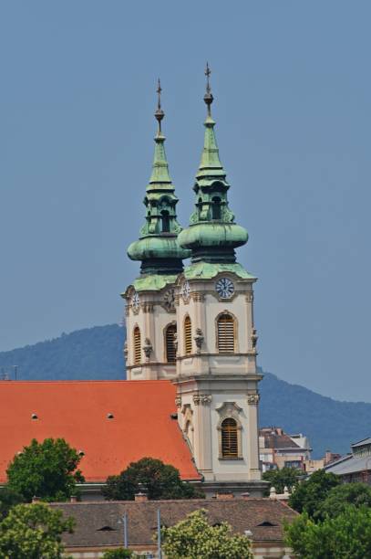 An exterior view of the architectural detail of a religious church building in the city of Budapest in Hungary.