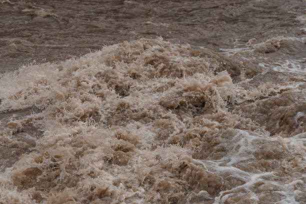 istock Turbulent Brown Water Waves Crashing in a Natural Setting 2192009740