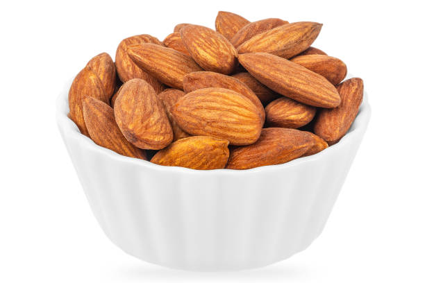 istock Almonds nuts in a white ceramic bowl isolated on white background 2192009787