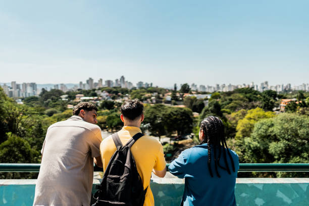 istock Young friends talking looking at view outdoors 2192012099