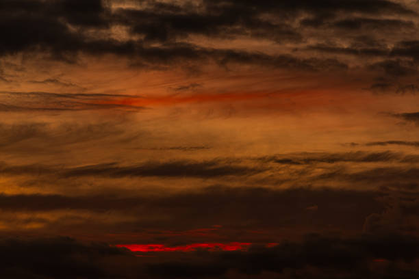 A truly mesmerizing sunset adorned with rich, vibrant colors and dynamic clouds, ideal for all nature lovers
