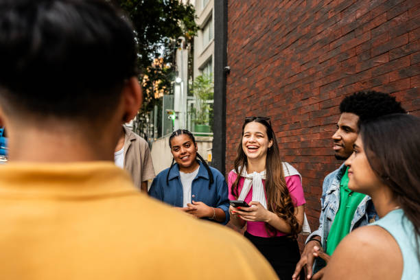 istock Young friends talking in the street 2192012609