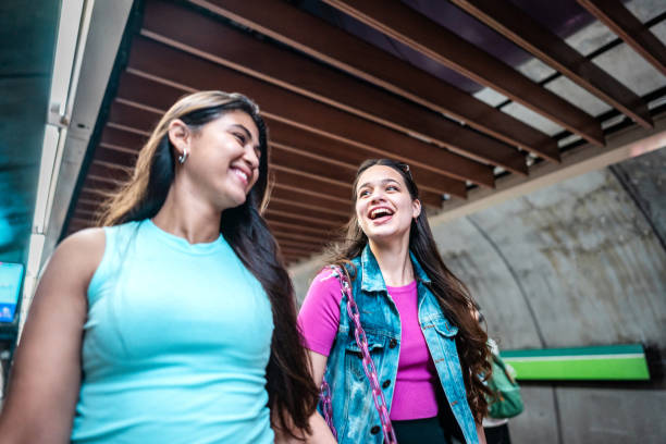 istock Young friends talking while walking at a subway station 2192012660