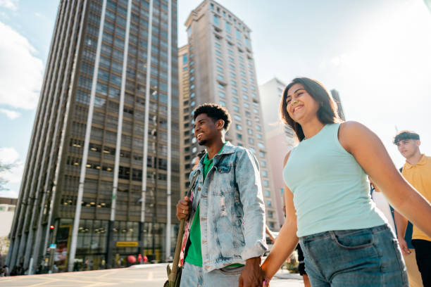 istock Young couple walking in the street 2192012695