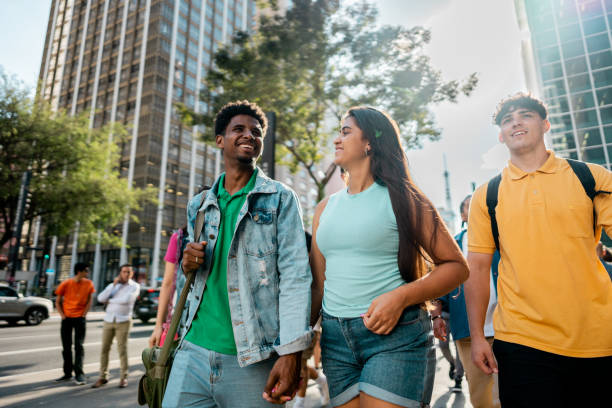 istock Young friends walking in the street 2192012705