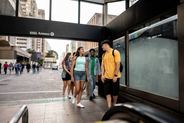 istock Young friends talking while entering the subway station 2192012835