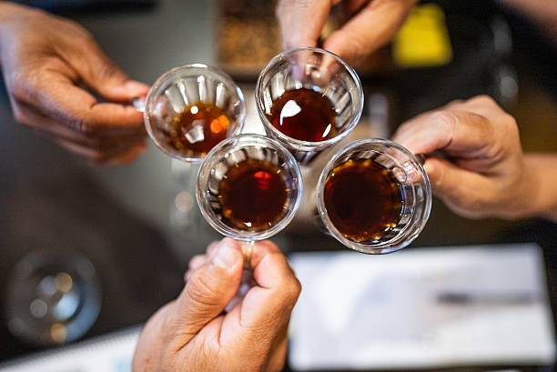 People toasting with coffee in a barista workshop