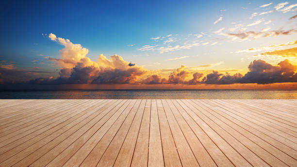 istock Empty wooden platform beside tropical sea shore during the sunset 2192016177