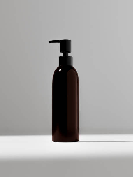 istock cylindrical Pump bottle mockup, slim lotion dispenser bottle, front view of dark brown plastic body wash packaging, pump lotion container, amber glass liquids dispenser, soap and hair product bottle 2192017255