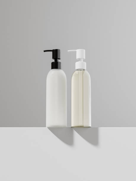 istock Pump bottles mockup, elegant cylindrical lotion dispenser bottles, low ankle view of translucent plastic packaging, clear liquid skincare container, frosted plastic pump bottle, spa product bottle 2192017258