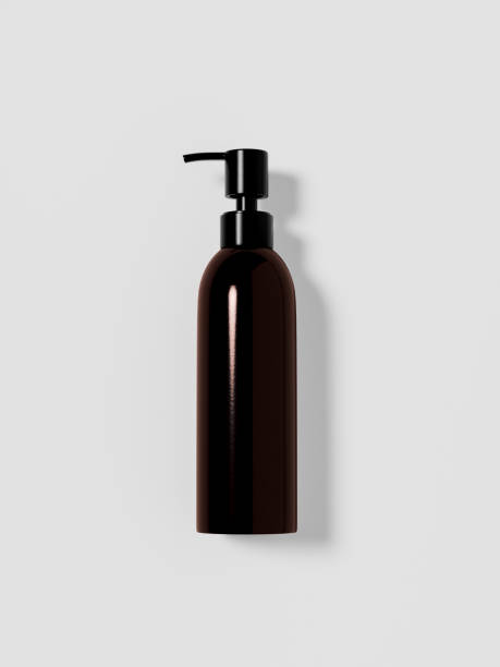 istock Slim Pump bottles mockup, cylindrical lotion dispenser bottle lay flat front view on white background, elegant dark brown plastic pump packaging, amber glass lotion container dispenser bottle mockup 2192017260