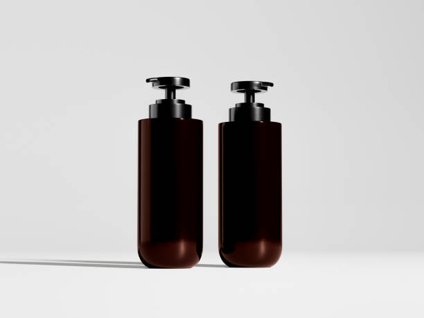 istock Pump bottles mockup, PET plastic dispenser bottles isolate on white background, dark brown cylindrical pump packaging, liquid cosmetic product dispenser container, amber glass round bottle mockup 2192017327