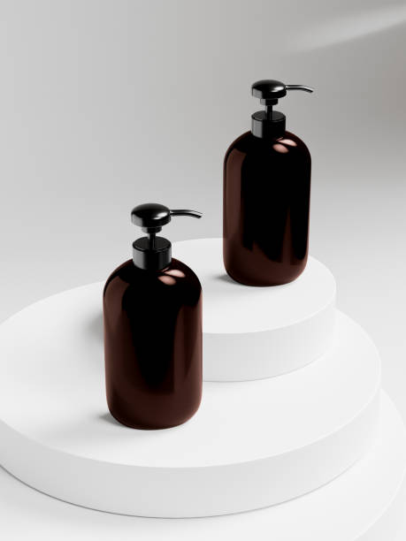 istock Pump bottles mockup, dark brown plastic dispenser bottles display on poduim, amber glass cylindrical cosmetic pump packaging, oval shape personal care product container, UV protective packaging 2192017339