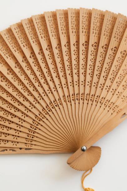 istock Wooden Hand Fan with laser cut design and pattern 2192018684
