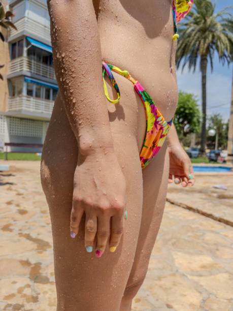 istock Unrecognizable woman in bikini at poolside in summer 2192019886