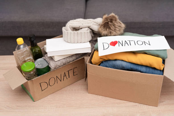 istock Two cardboard boxes with supplies on table ready for charity donation 2192024389