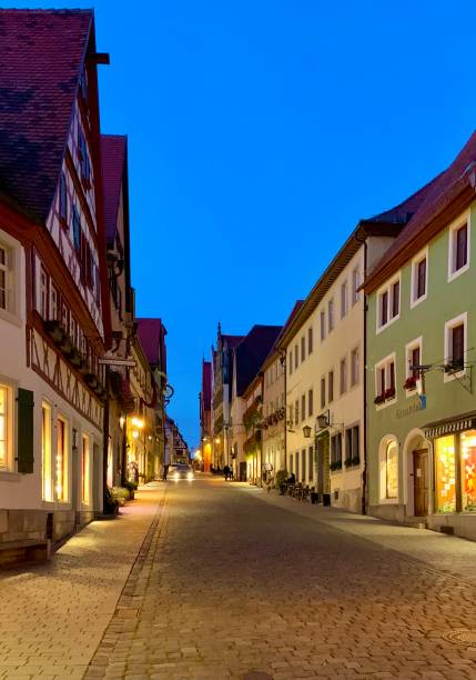 istock buildings and old street at dusk 2192029784