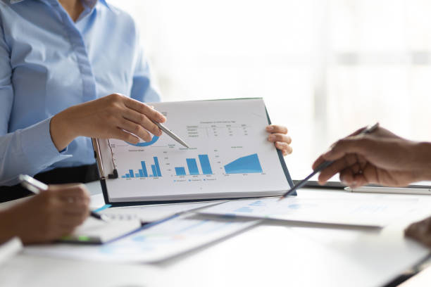 istock Business consulting meeting is discussing business plan analysis with financial data and business growth charts to plan strategies for generating company profits. 2192034253