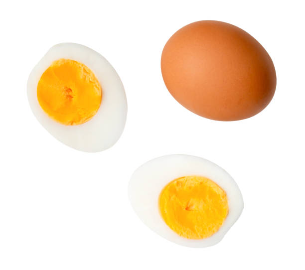 istock Top view set of raw chicken egg and cooked or boiled egg with egg yolk in two halves isolated on white background with clipping path 2192035624