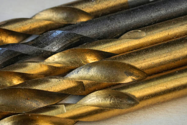 istock Close-Up of Gold and Black Metal Drill Bits 2192036235
