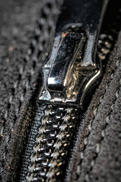 istock Close-Up of Metallic Zipper on Black Fabric 2192036264