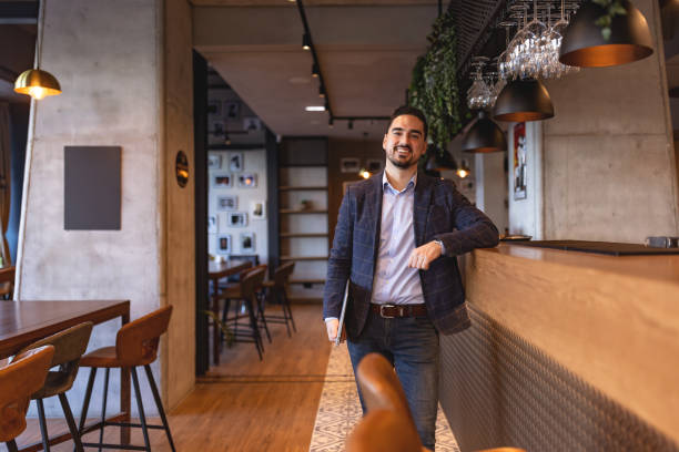 istock Restaurant manager smiling and posing in his restaurant 2192037507