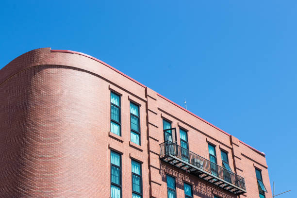 istock Modern style brown brick building on dark sky background 2192037839