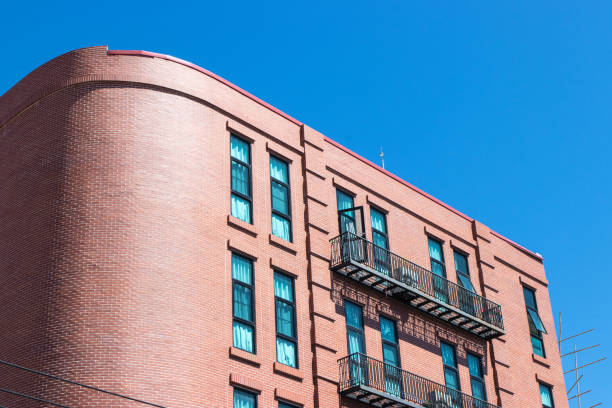 istock Modern style brown brick building on dark sky background 2192037857