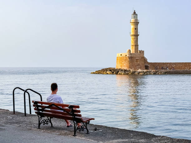 Chania, Crete – August 2, 2025:  A vibrant view across the Venetian Harbour showcases the colorful buildings of Chania’s Old Town.