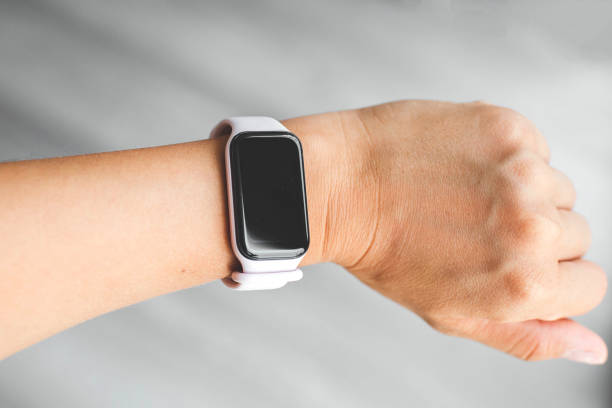 istock smart watch bracelet on a pink strap on a woman's hand, space for text, copyspace 2192040015