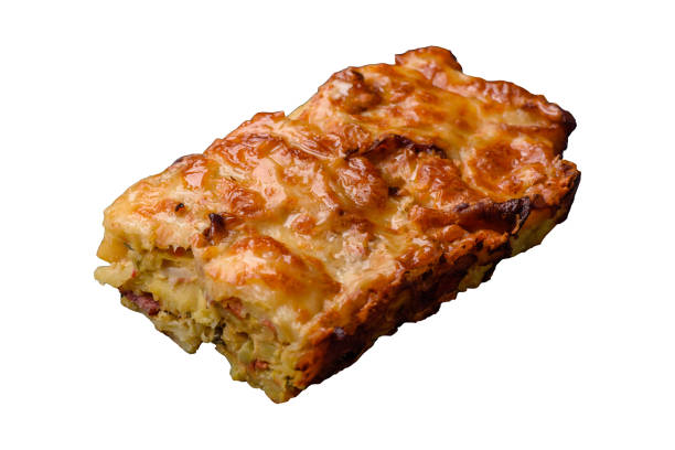Lasagna or pasta layered with meat, cheese, salt, spices and herbs on a white background