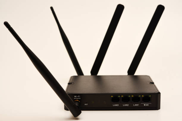 istock GSM modem. An Internet station with a SIM card. A black router on a white background. 2192045702