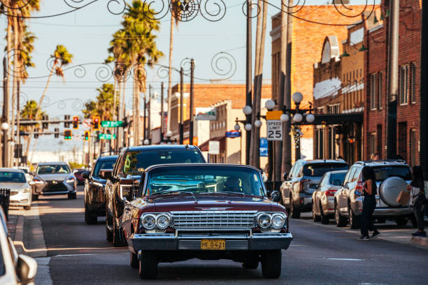 Ybor City, Tampa Bay, Florida, USA - Retro car in traffic  on famous 7th Avenue in the Historic Ybor City.