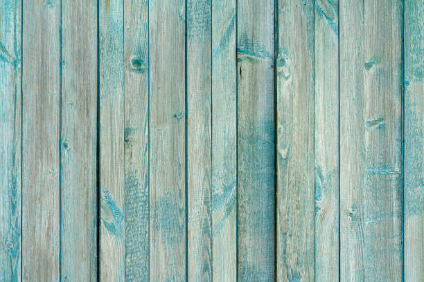 Old wooden planks with peeling paint.