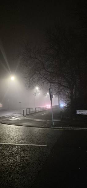 istock Empty road in a foggy night 2192053423