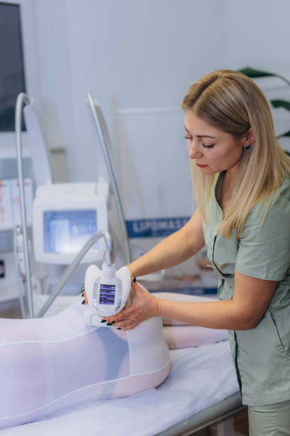 istock Lpg massage procedure. Hands of therapist holding lipomassage tool. 2192053922