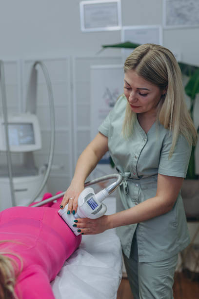 istock Lpg massage procedure. Hands of therapist holding lipomassage tool. Close up, selective focus. 2192053961