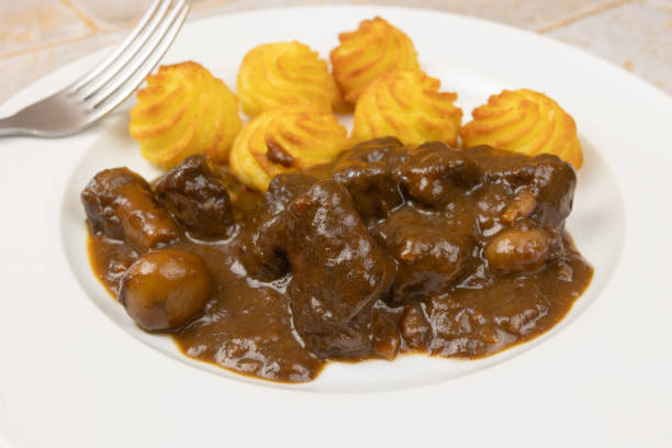 istock beef bourguignon and duchesse potatoes, close-up, on a plate 2192055819