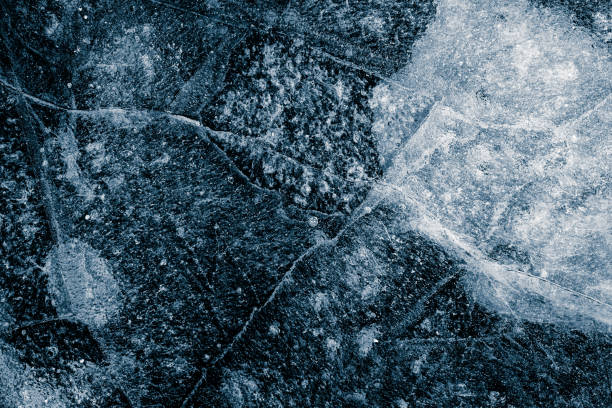 Ice texture background. The textured rough crushed cold frosty surface of the ice block background.