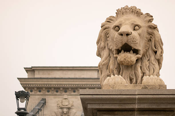 istock close-up of lion statue at chain bridge in Budapest 2192058517