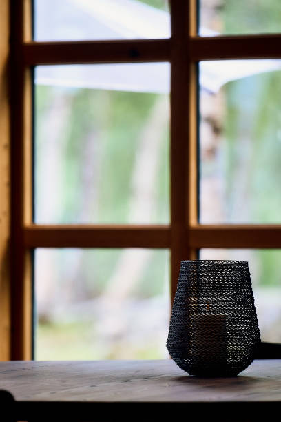 istock Candle  holder on a wooden table 2192058592